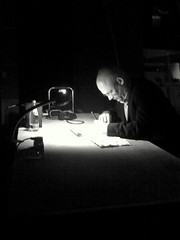 man writing at a desk