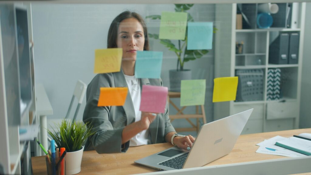 woman at desk with post-its